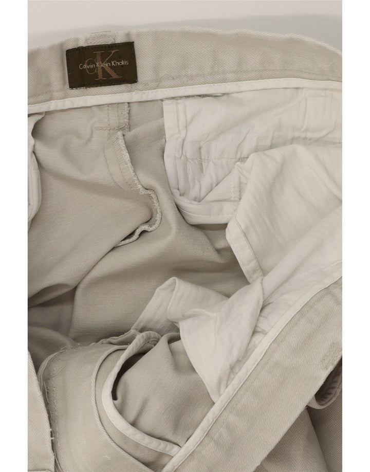 Pantalones chinos con corte de bota para hombre Calvin Klein W34 L32 Beige
