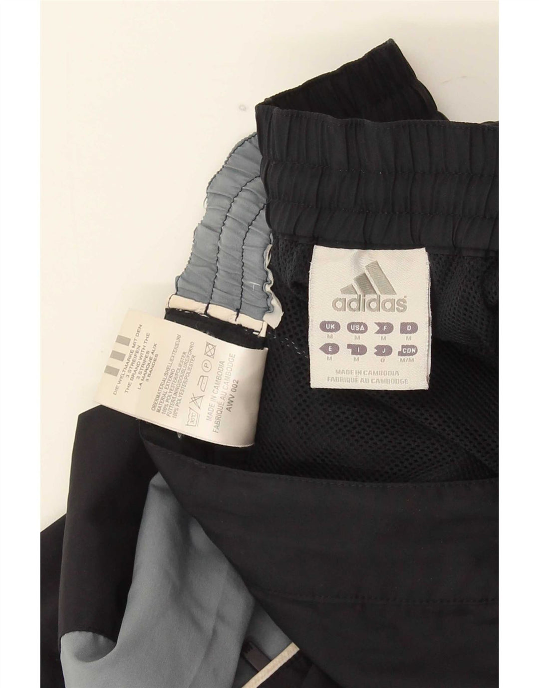 Adidas - Pantalones cortos deportivos con estampado gráfico para hombre, color negro medio, poliéster con bloques de color