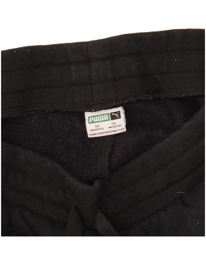 PUMA Pantalones de chándal con estampado gráfico para niños de 10 a 11 años, mediano, negro