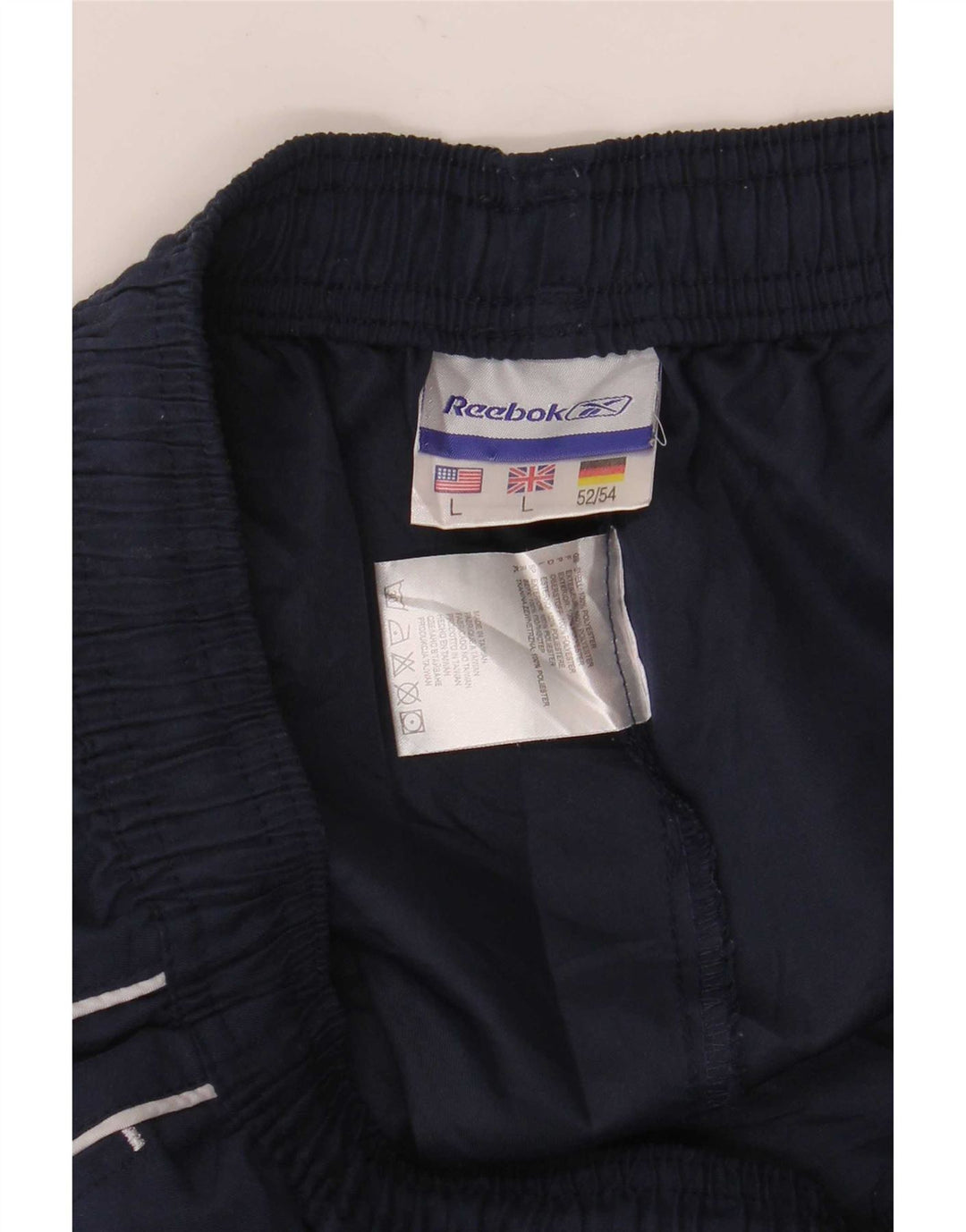 Reebok - Pantalón de chándal gráfico para hombre, talla grande, poliéster, azul marino