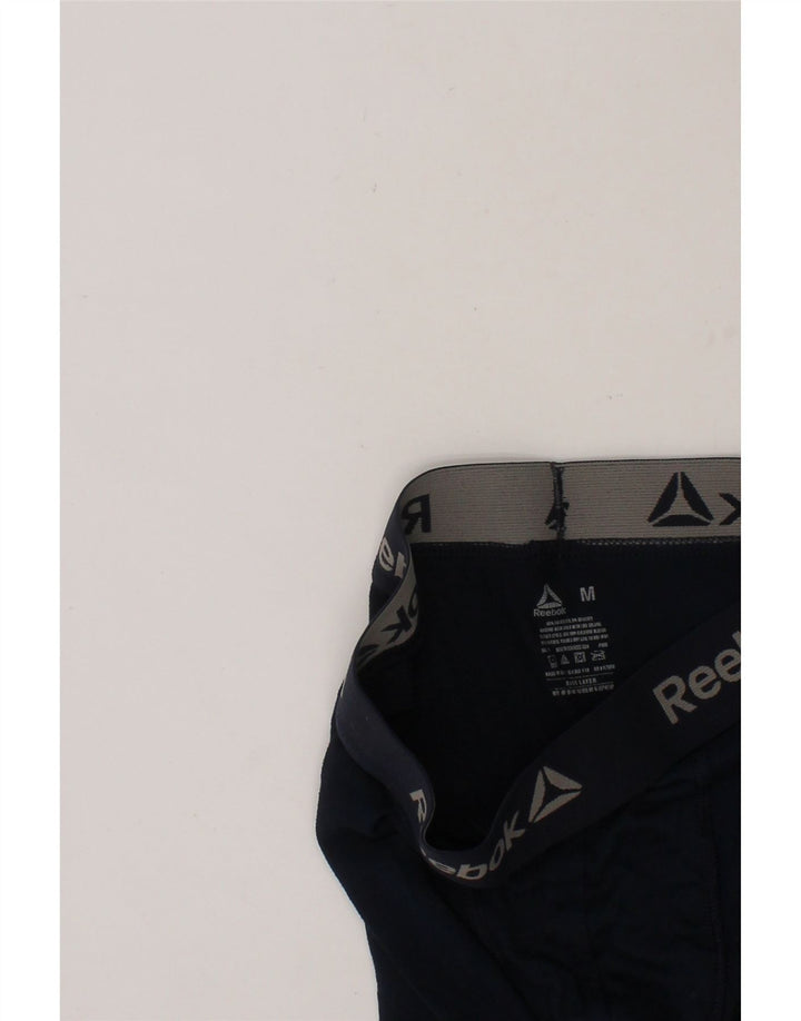 REEBOK Girls Graphic Leggings 7-8 Years Medium Navy Blue Polyester Vintage Reebok and Second-Hand Reebok from Messina Hembry 