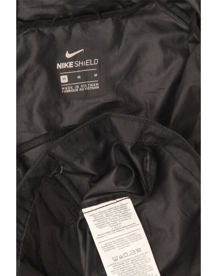 Nike - Chaqueta impermeable con capucha para mujer, talla M, color negro, poliéster, deportiva