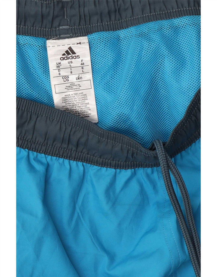 Adidas Pantalones cortos deportivos con estampado gráfico para hombre Poliéster color block azul grande
