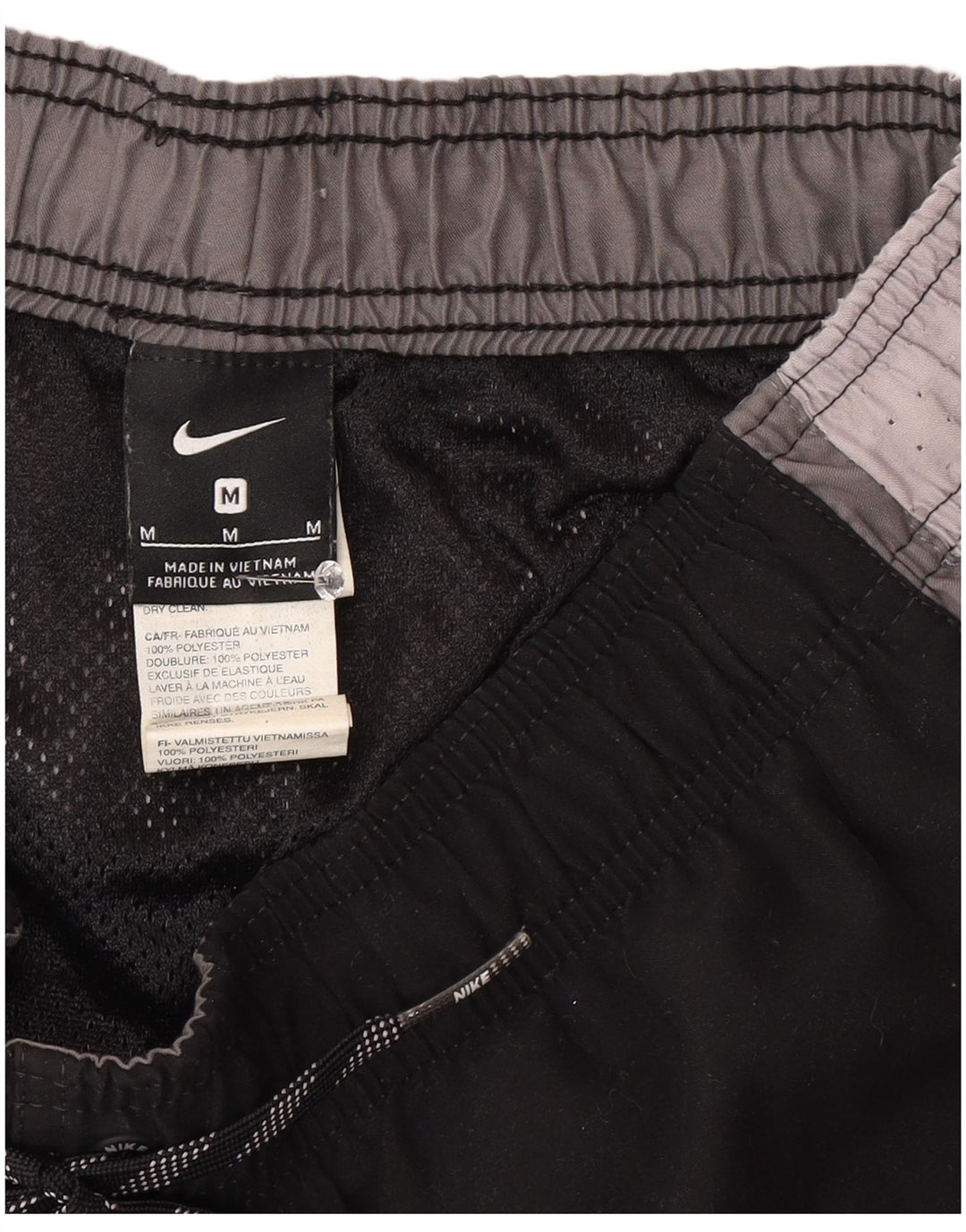 Pantalón corto deportivo Nike para hombre Poliéster color block en negro mediano