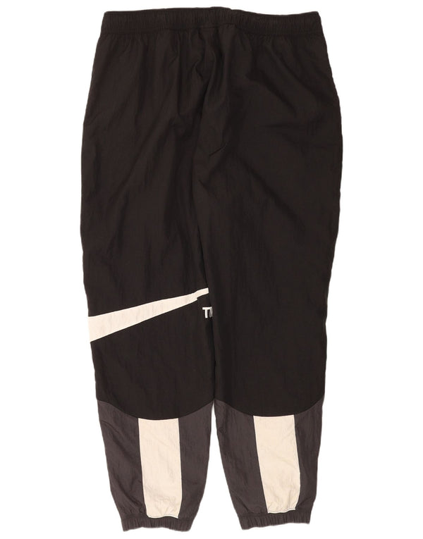Nike - Pantalón de chándal gráfico para hombre, talla 2XL, nailon color negro