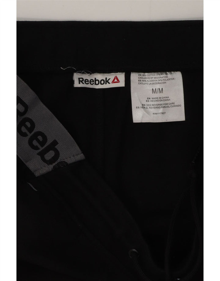 REEBOK Hombre Pantalones de chándal con estampado gráfico Joggers Medium Black Colourblock