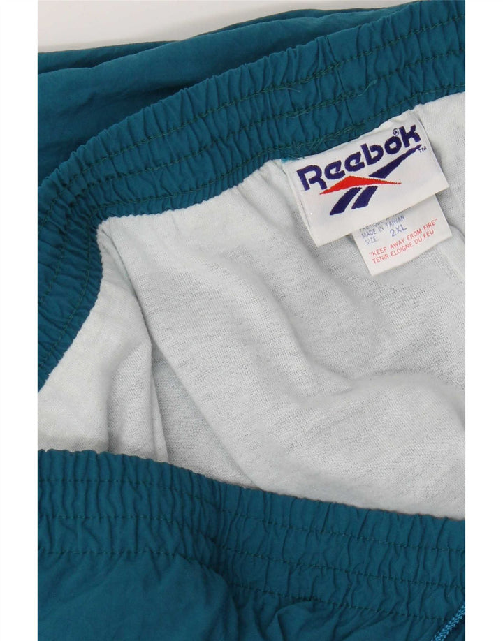 Reebok - Pantalón de chándal para hombre, talla 2XL, nailon azul