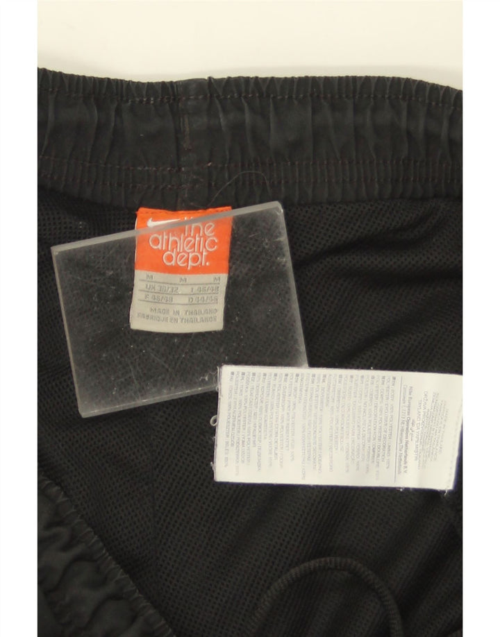 Pantalones cortos deportivos con estampado gráfico de hombre Nike Poliéster color block en negro mediano