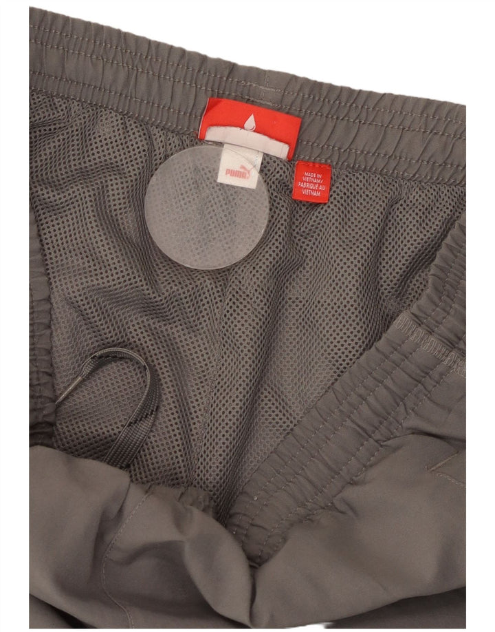 PUMA Pantalones de chándal con estampado gráfico para hombre Joggers Small Grey