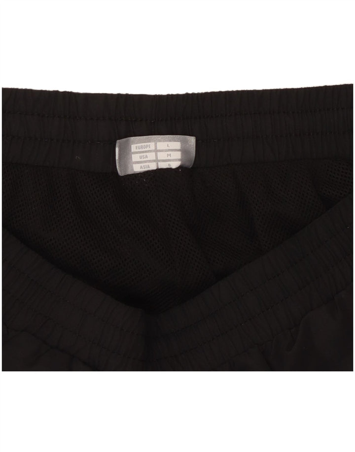 HUMMEL Pantalones de chándal con estampado gráfico para hombre Poliéster negro mediano