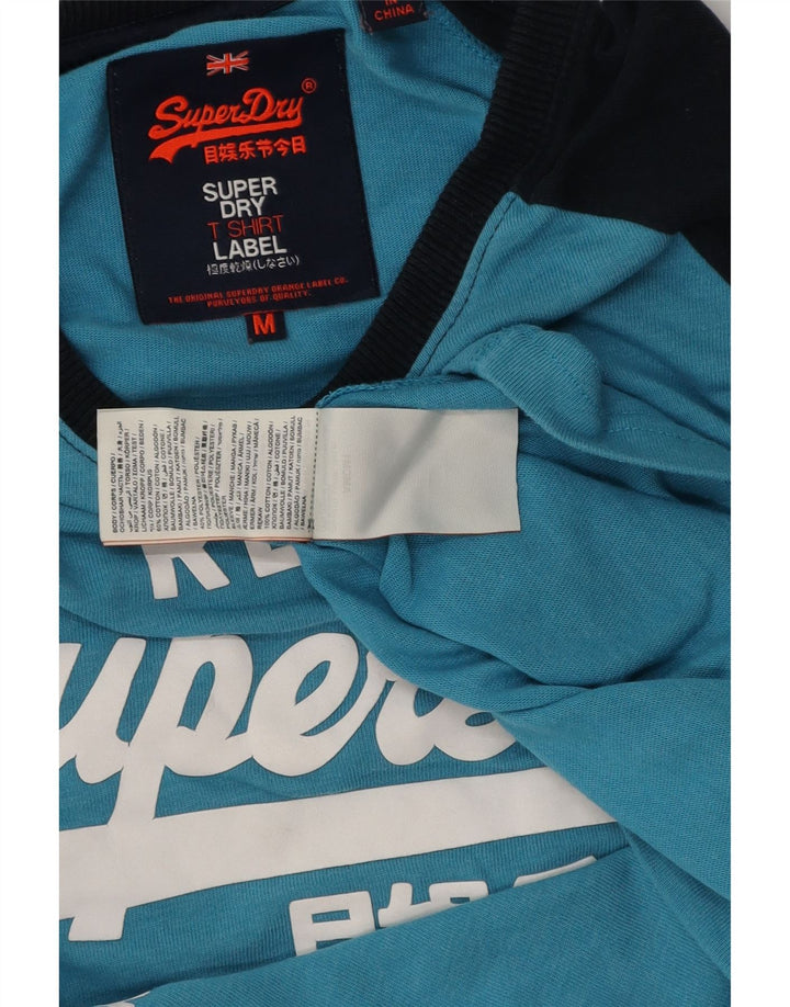 Superdry Hombre Top gráfico de manga larga de algodón color block en azul medio