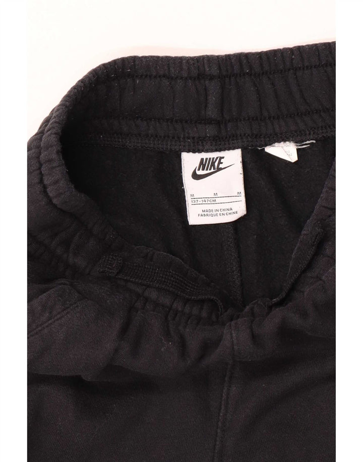 Nike Pantalones de chándal con gráfico para niños, 10-11 años, mediano, negro