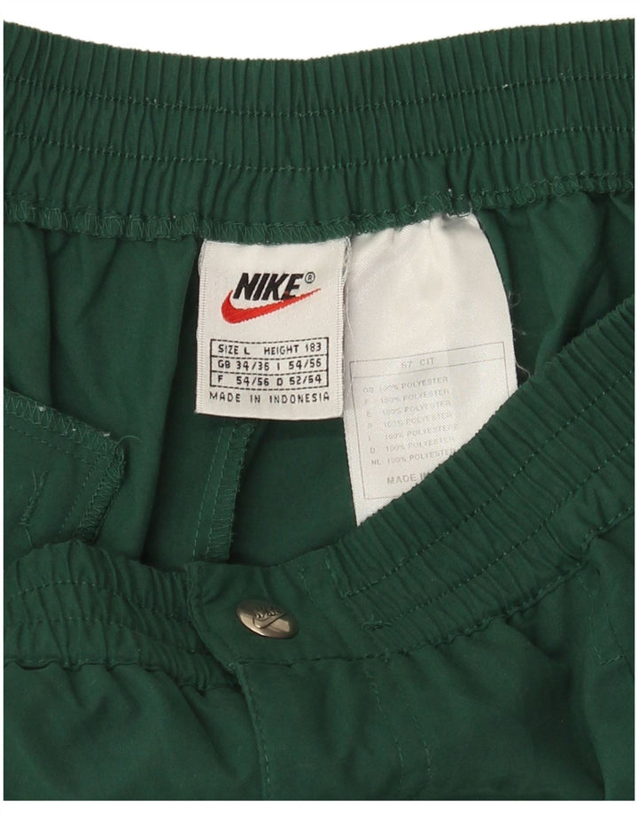 Nike - Pantalones cortos chinos pegados para mujer, talla grande, W34, poliéster verde