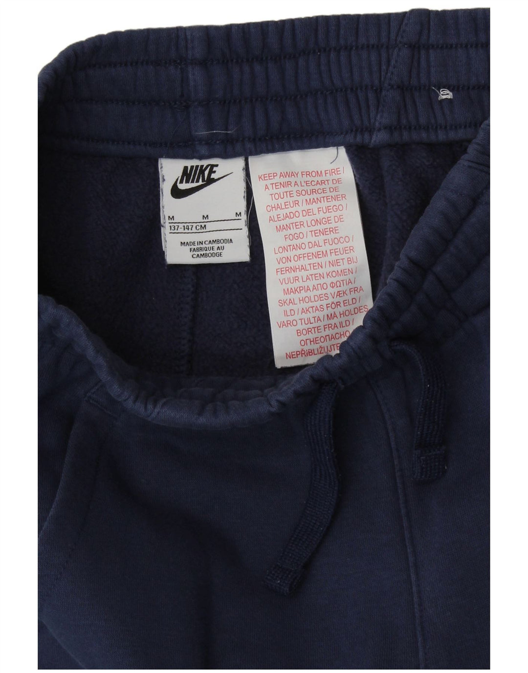 NIKE Pantalones de chándal con gráfico para niños, 10-11 años, mediano, azul marino