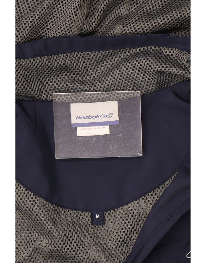Reebok Chaqueta cortavientos con capucha y cremallera para hombre UK 38 Medium Azul marino Deportes