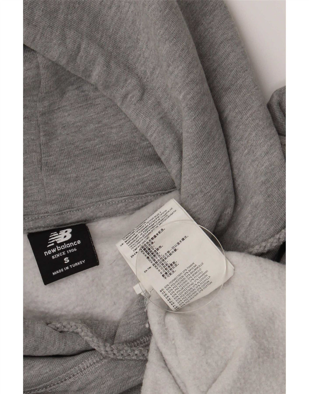 New Balance Hombre Sudadera Con Capucha Gráfica Jersey Pequeño Gris Poliéster