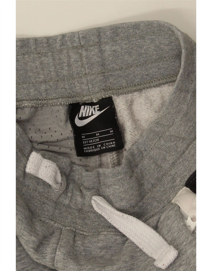 Nike - Pantalones de chándal para niño, 10-11 años, color gris medio