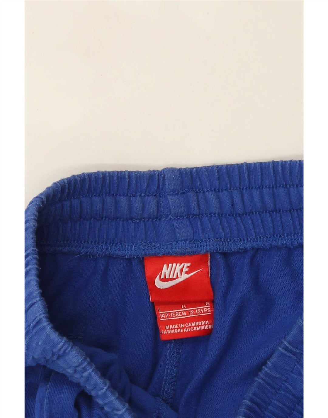 Nike - Pantalones cortos deportivos con gráficos para niños, 12-13 años, talla grande, color azul