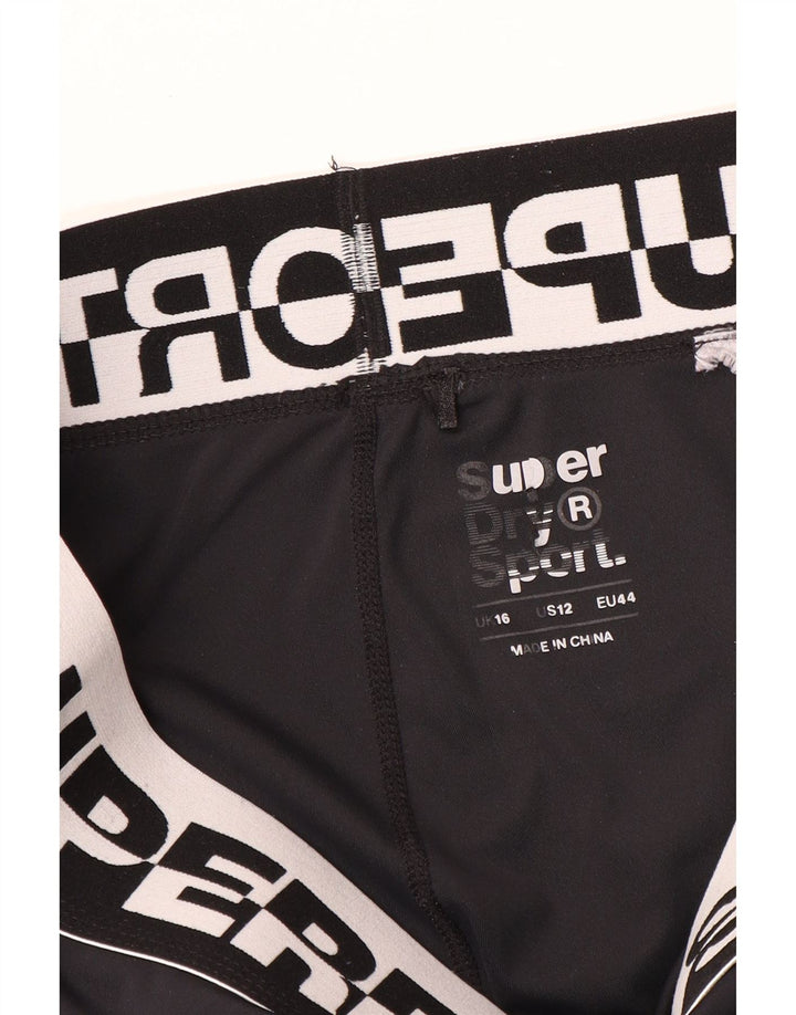 Superdry Leggings cortos con estampado gráfico para mujer, talla 46, color negro