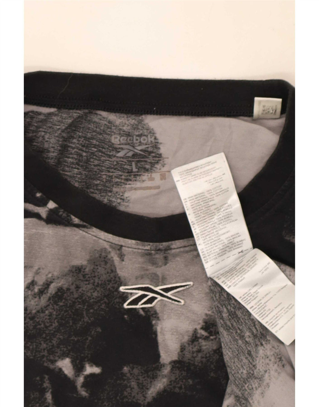 Reebok Camiseta con estampado abstracto para hombre, talla grande, algodón negro