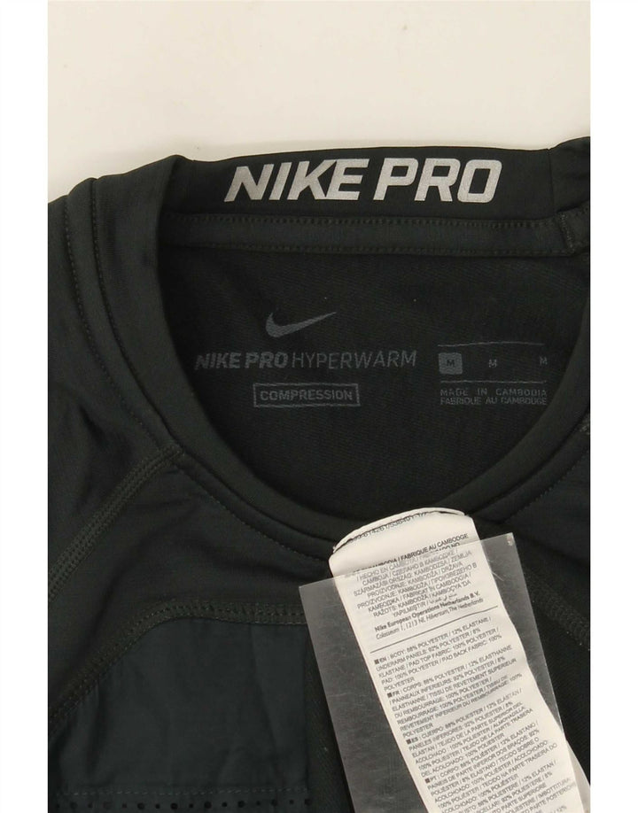 Nike - Camiseta gráfica de manga larga para hombre, color verde medio, poliéster color block