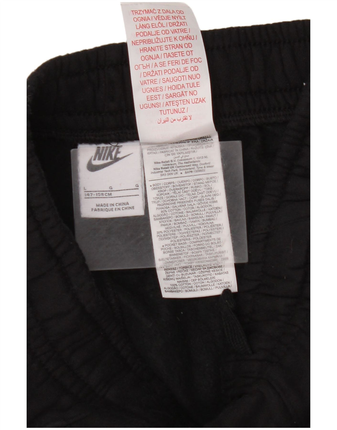 NIKE Pantalones de chándal con estampado gráfico para niños, 12-13 años, grande, negro