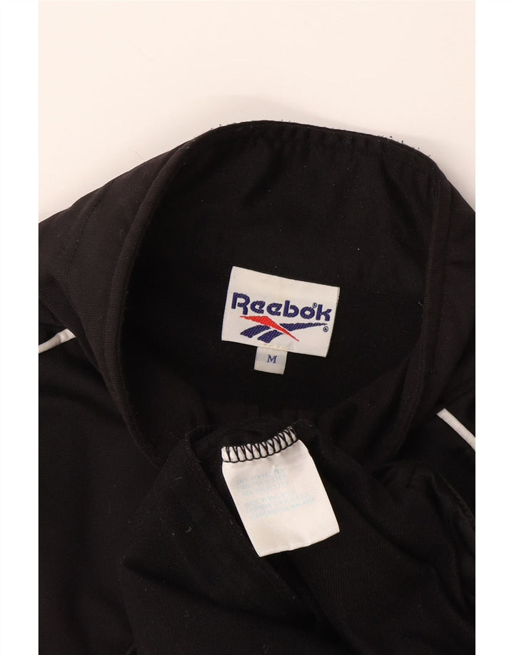 Reebok - Chaqueta de chándal de manga corta con gráfico para hombre, talla mediana, color negro