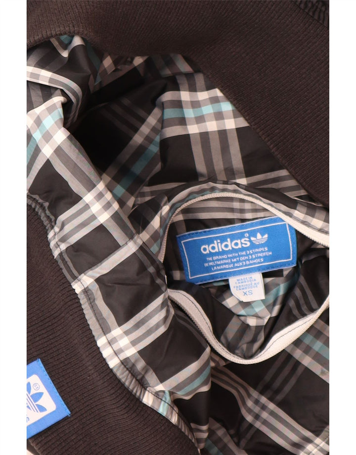 Adidas Chaqueta superior de chándal con capucha y gráfico para hombre XS Poliéster negro