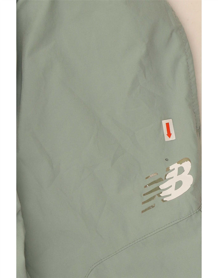 Pantalón New Balance Cargo Chándal Verde Medio Poliéster Hombre