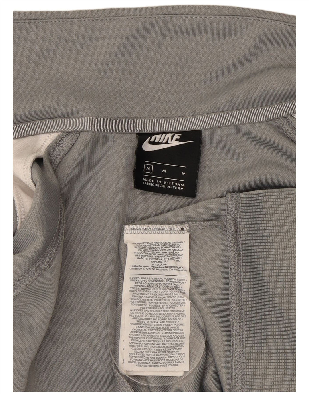 Nike Chaqueta deportiva con gráfico Swoosh y bloques de color gris medio para hombre