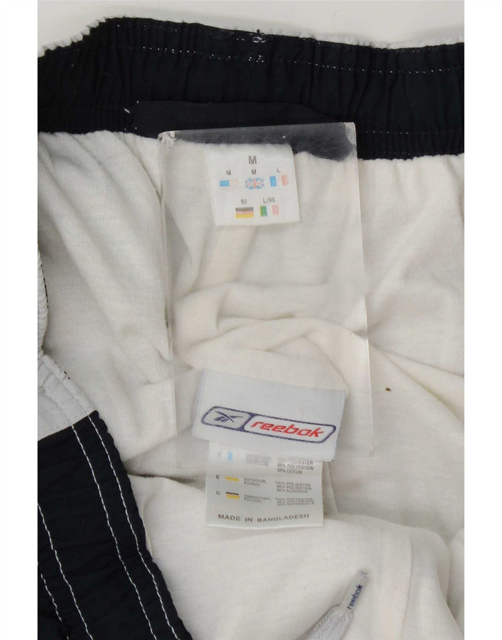 Bermudas deportivas Reebok Hombre Gris medio Colorblock Poliéster