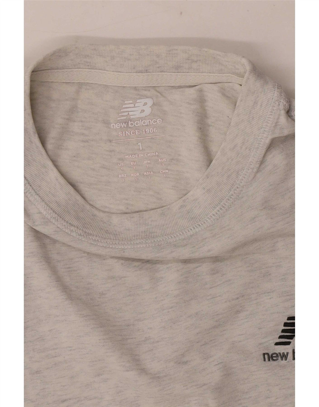 New Balance Hombre Camiseta Top Small Gris Moteado