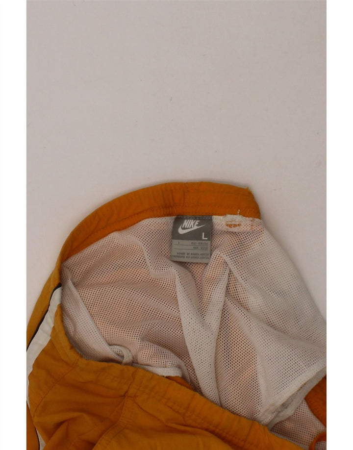 NIKE Boys Graphic Sport Shorts 12-13 Years Large Orange Vintage Nike and Second-Hand Nike from Messina Hembry 
