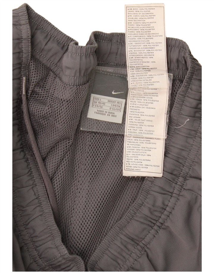 Nike - Pantalones de chándal para hombre, color gris, poliéster