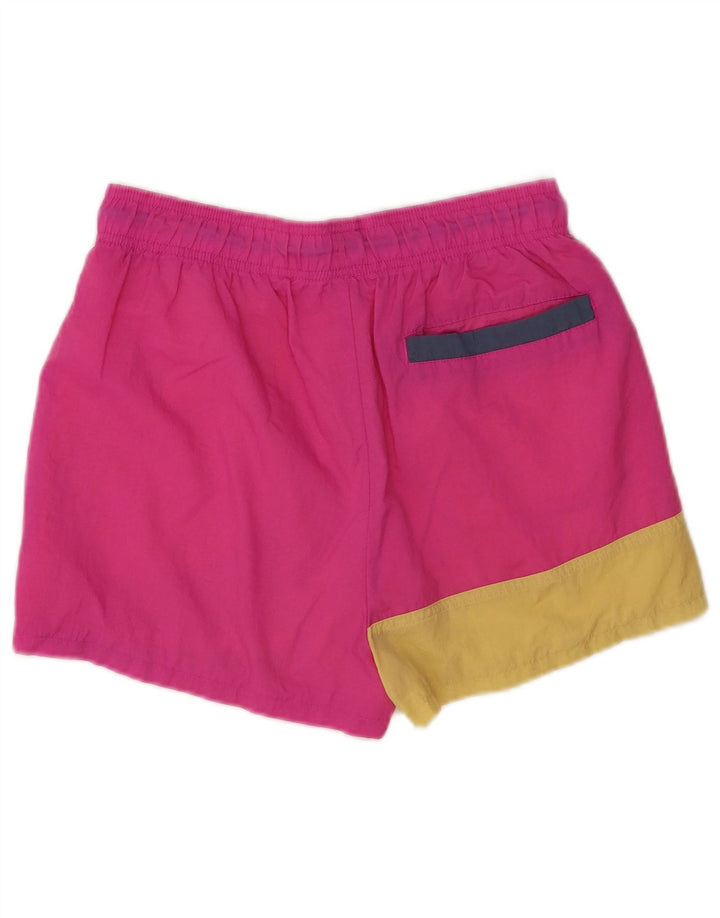 Pantalones cortos deportivos Nike de nailon color block en rosa mediano