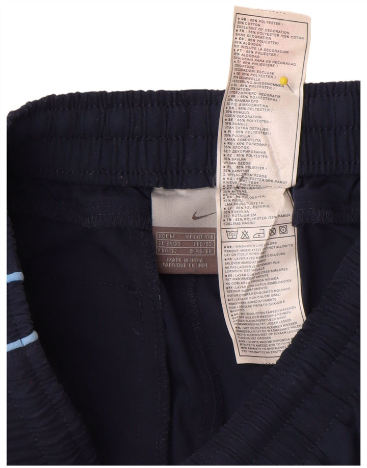 Nike Pantalones de chándal capri con gráfico gráfico en color azul marino mediano