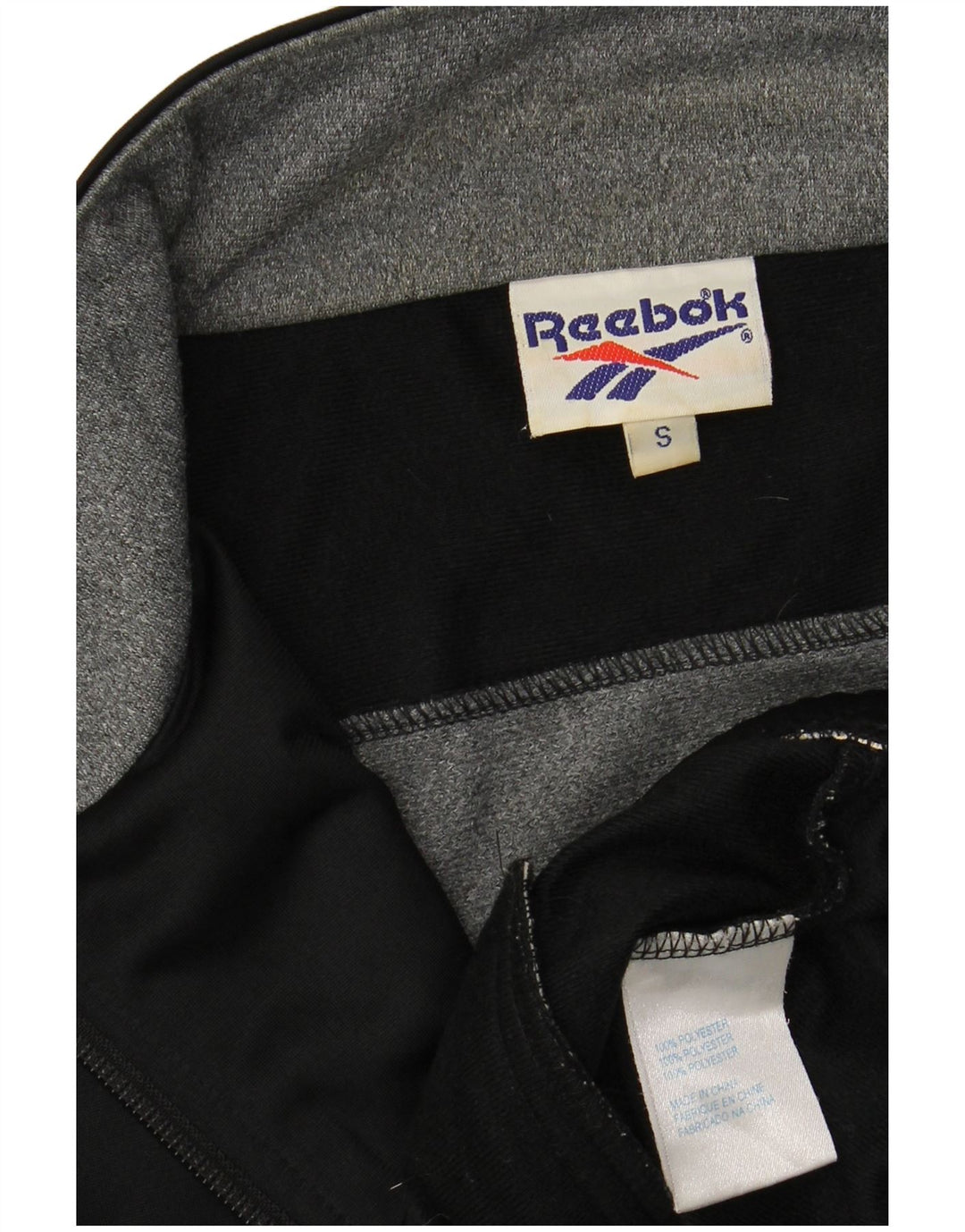 REEBOK Chaqueta superior de chándal con gráfico de corte holgado para hombre Small Black Colourblock