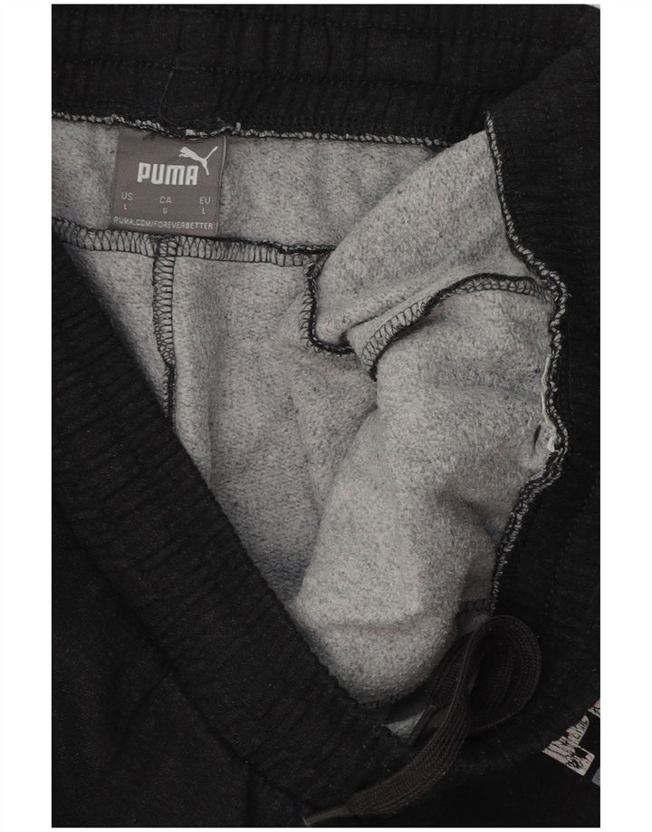 PUMA Pantalones de chándal con estampado gráfico para hombre Joggers Large Black