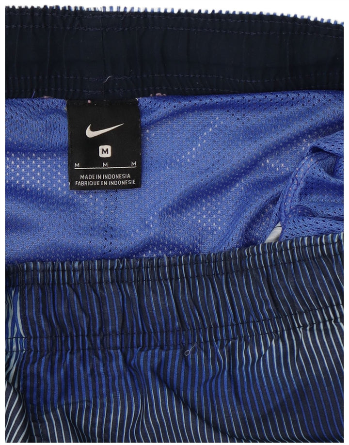 Pantalones cortos deportivos Nike para hombre azul medio con rayas diplomáticas