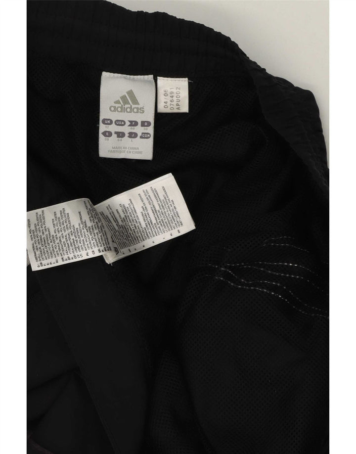 Adidas Pantalones de chándal a prueba de clima para mujer UK 12 Mediano Negro Poliéster