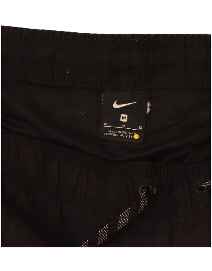 Pantalón corto deportivo Nike para hombre Poliéster color block en negro mediano