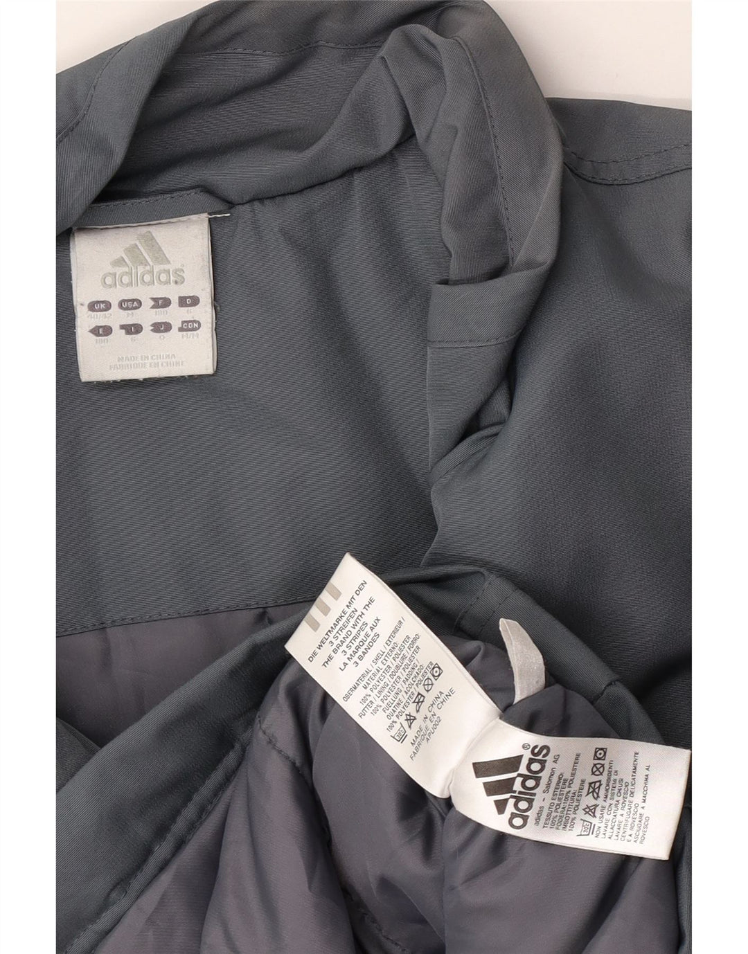 Adidas Chaqueta cortavientos holgada con gráfico para hombre Reino Unido 40/42 Gris medio