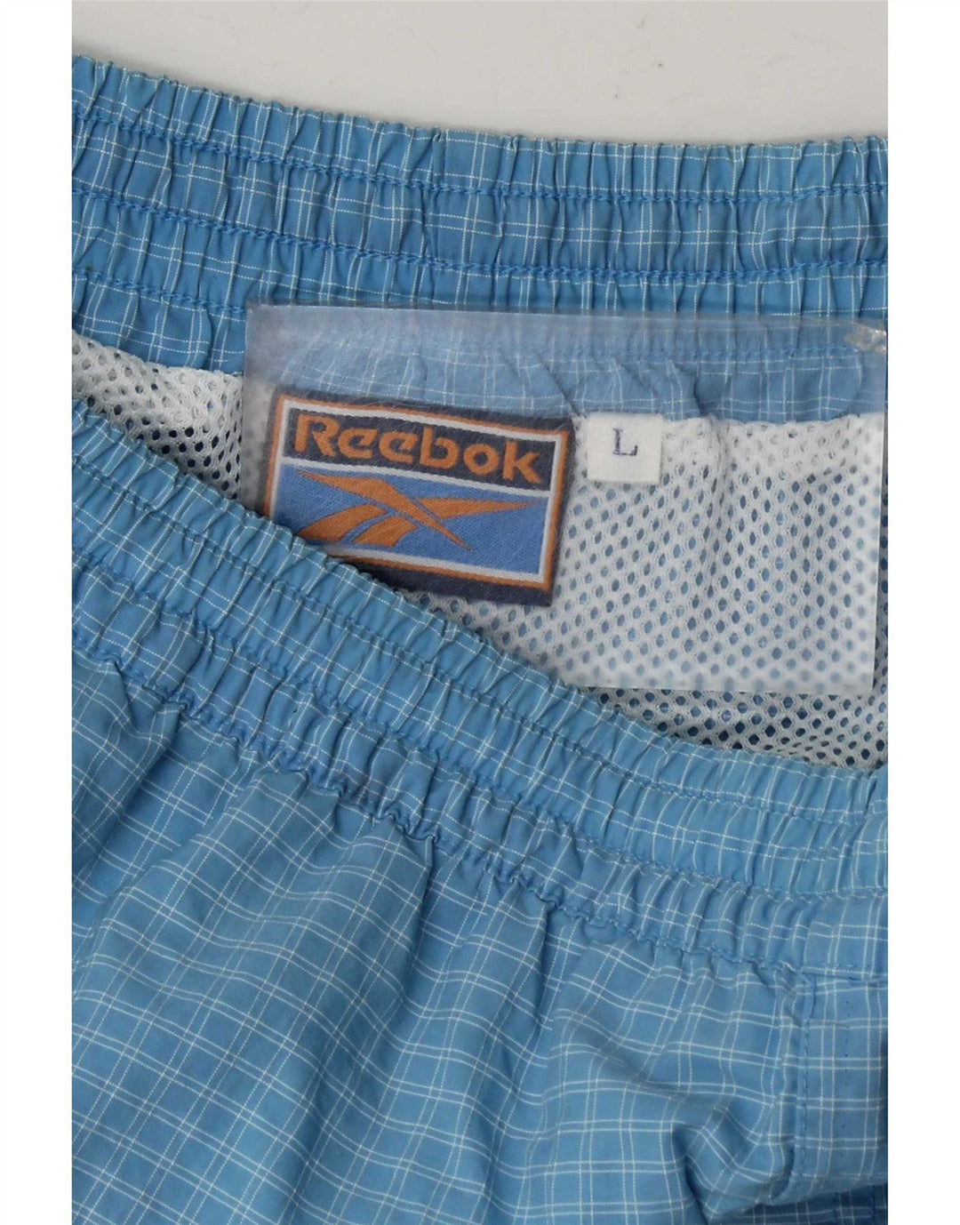 Pantalones cortos deportivos Reebok para hombre, cuadros azules grandes