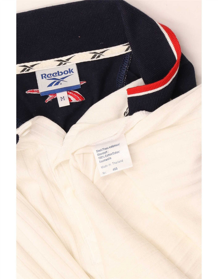 Polo Reebok de algodón color block en blanco mediano para hombre