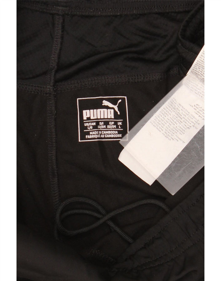 PUMA Pantalones de chándal con estampado gráfico para hombre, poliéster negro grande