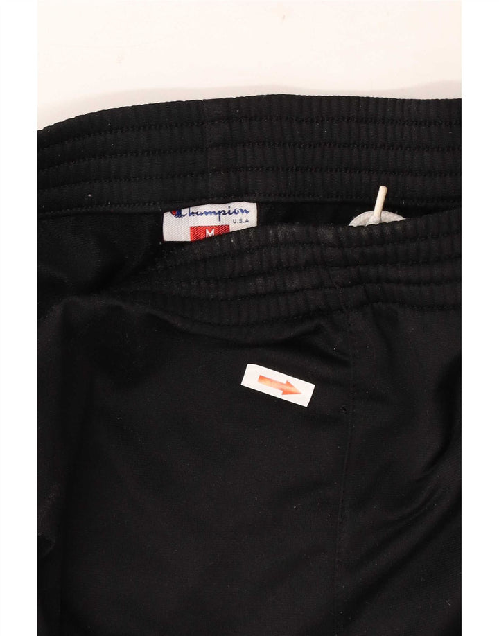 Champion Pantalones De Chándal Estampados En Negro Mediano Colorblock