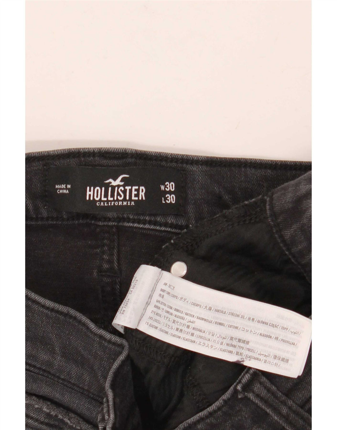 Vaqueros ajustados desgastados para hombre Hollister W30 L30 algodón gris