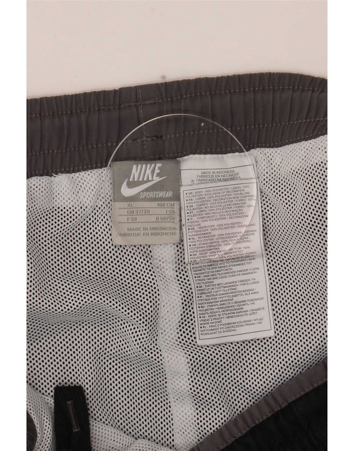 Nike Pantalones De Chándal Gráfico Hombre XL Poliéster Negro