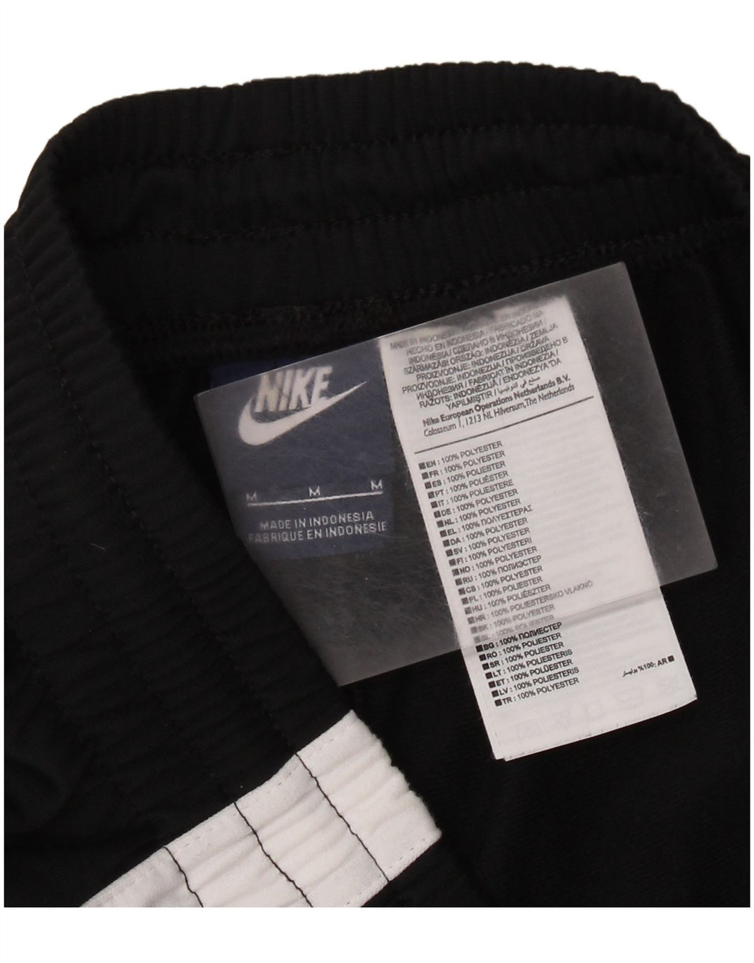 NIKE Hombre Pantalones de chándal Medium Black Colourblock Poliéster