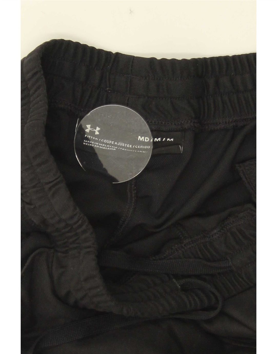 Under Armour Pantalón de chándal ajustado en color negro mediano